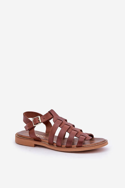 Exquisite brown natural leather sandals from Step in Style, featuring a modern woven design with adjustable buckle, elegantly displayed from a side angle.