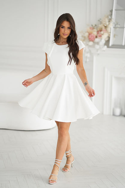 Bicotone stylish white cocktail dress with decorative ruffles, elegantly twirling above the knee, ideal for special events.