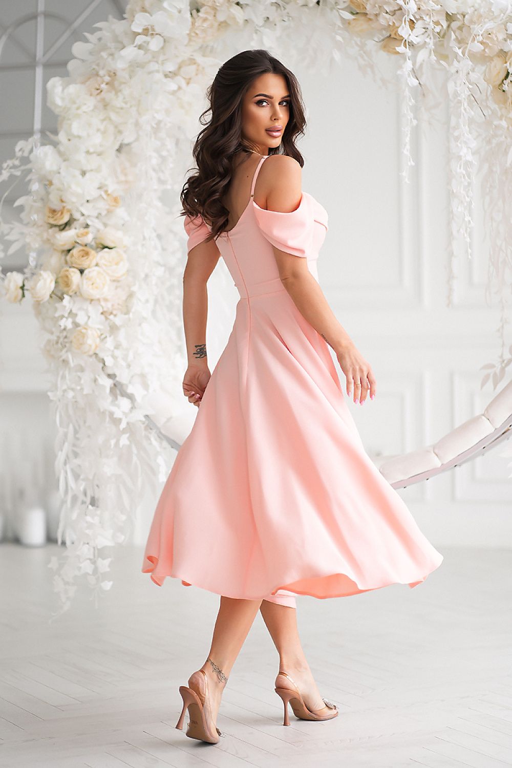 Stylish pink midi dress showcasing a feminine design with off-shoulder sleeves and flowing skirt, crafted by Bicotone.