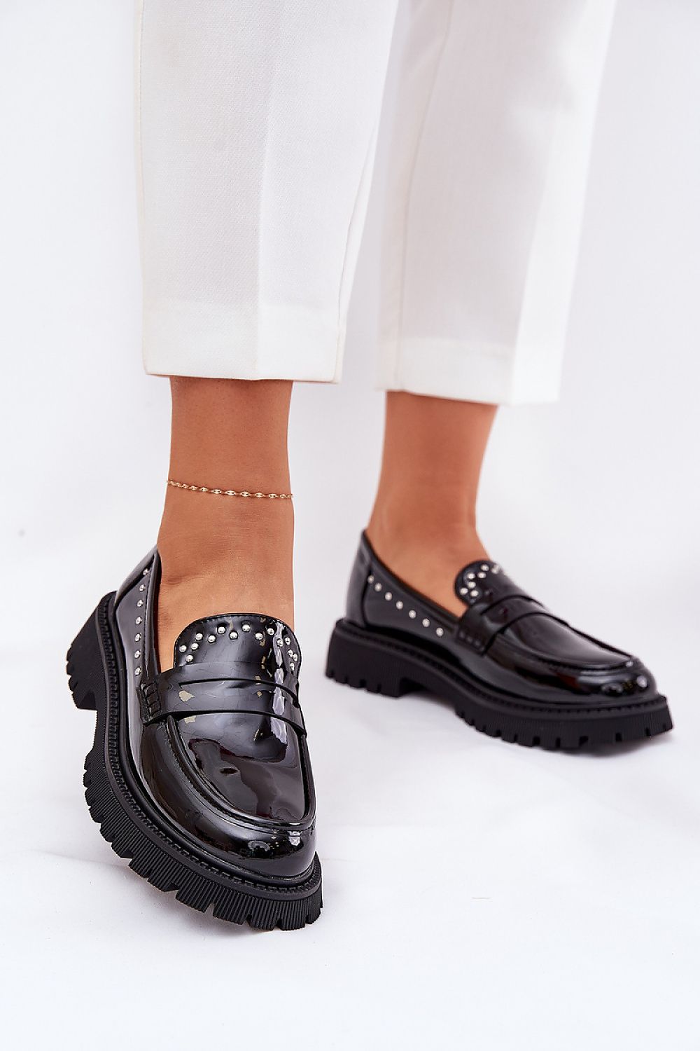 Elegant women's moccasins by Step in Style, crafted in patent eco leather with unique embellishments, showcasing a stylish flat heel.