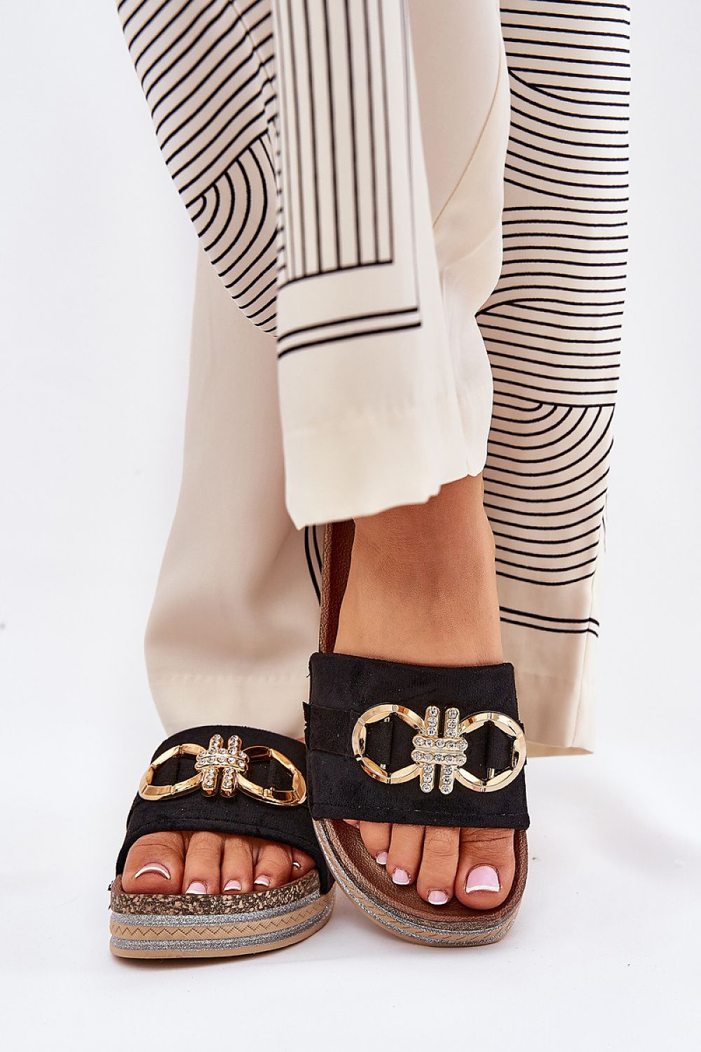 Elegant platform flip-flops with golden accents by Step in Style, showcasing a stylish design perfectly paired with modern outfits.