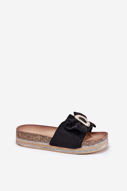 Luxury eco suede black flip-flop slipper featuring a decorative bow and brooch, offering a sophisticated platform design by Step in Style.