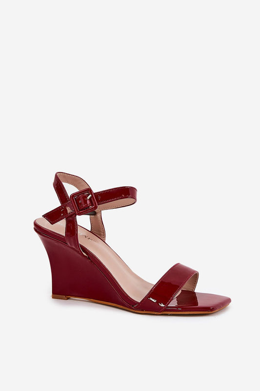 Sleek red eco leather wedge sandals by Step in Style, highlighting a chic and modern silhouette. Ideal for pairing with various outfits, these sandals add a touch of luxury to any look.