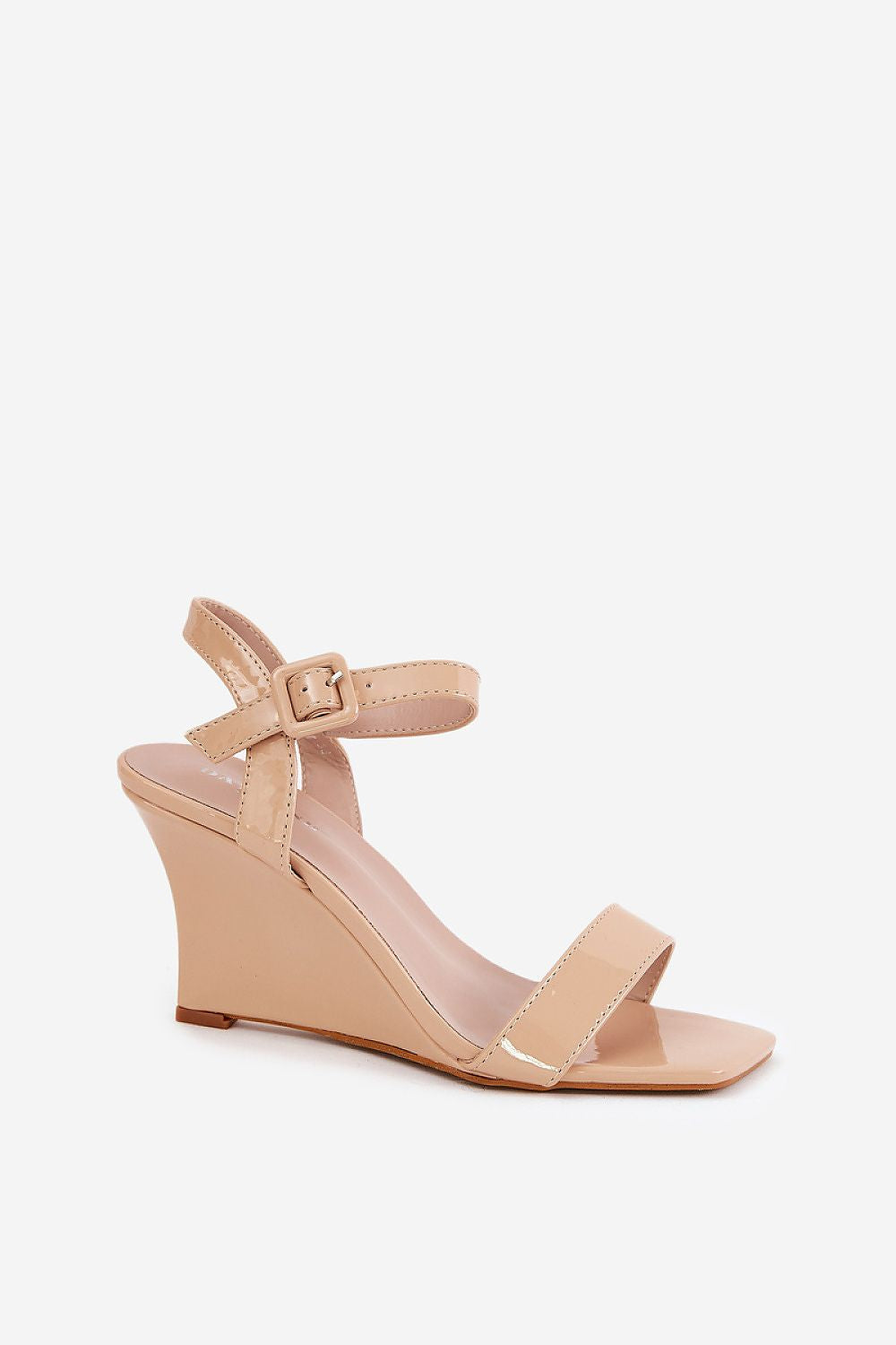 Sophisticated eco leather wedge sandals in nude, highlighting a minimalist design and adjustable buckle, isolated on a white background, by Step in style.