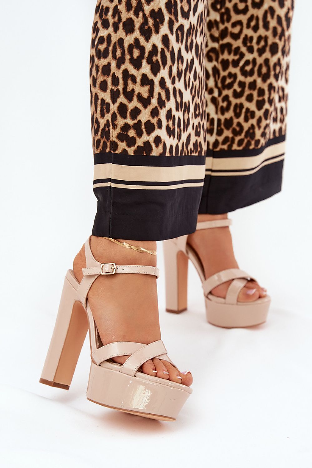 Elevate your style with Step in Style's luxurious beige high block heel sandals, featuring a chic ankle strap and intertwining front straps.