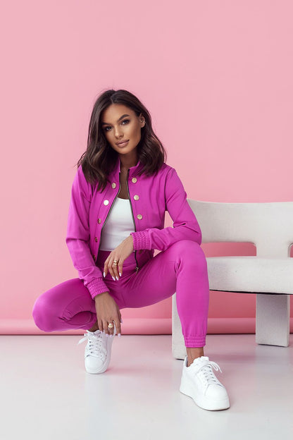 LaBalancia Women's Elegant Set in chic pink, model poses in a fashionable stance highlighting the sleek long trousers and elegant blouse. Captivating styling aimed at modern women who value sophistication and comfort.