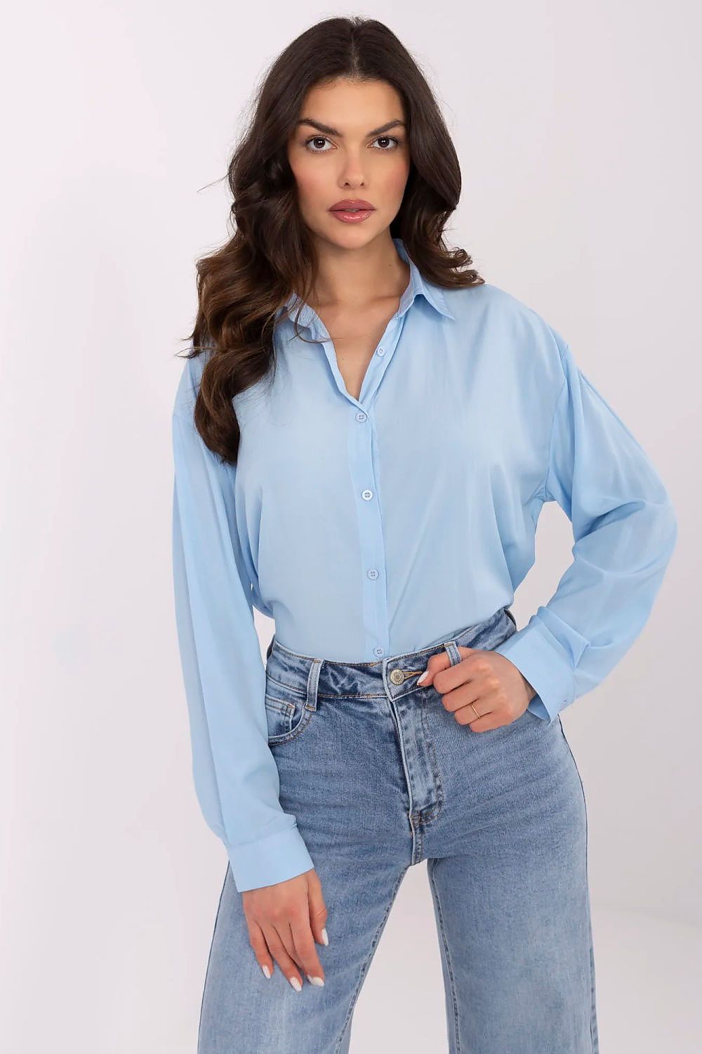 Stylish long sleeve blue women's shirt by NM, perfectly styled with denim jeans for an elegant casual outfit.