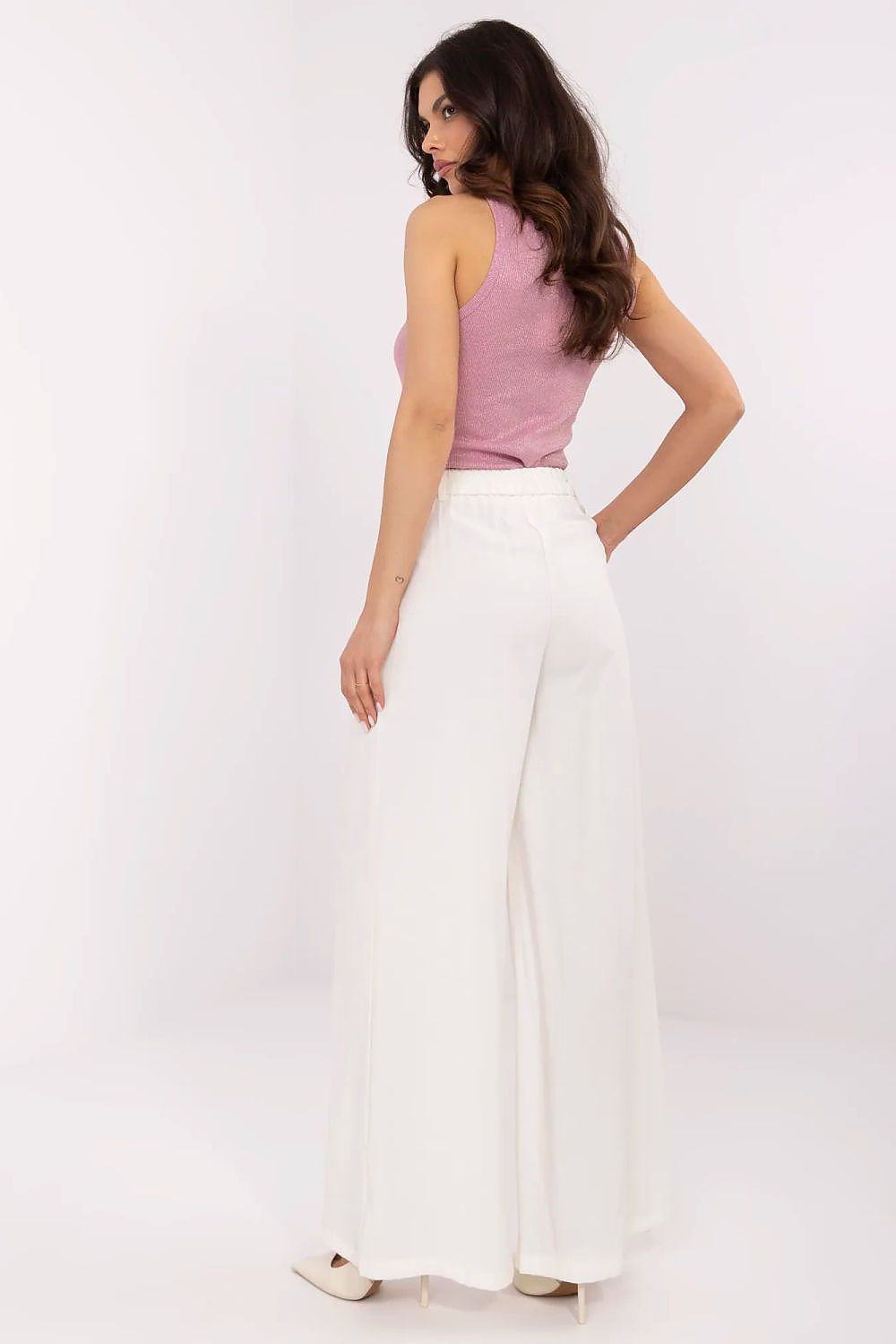 Elegant women's palazzo pants in white, designed by NM, showcasing a high-quality viscose material and a stylish fit for formal occasions.