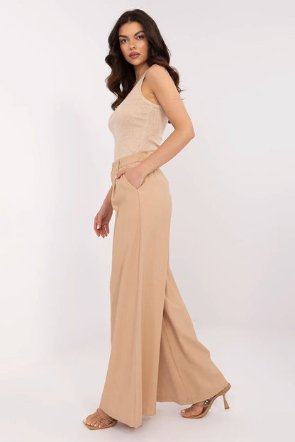 Side view of high-quality beige palazzo pants for women, designed by NM, highlighting comfort and timeless style for any formal event.