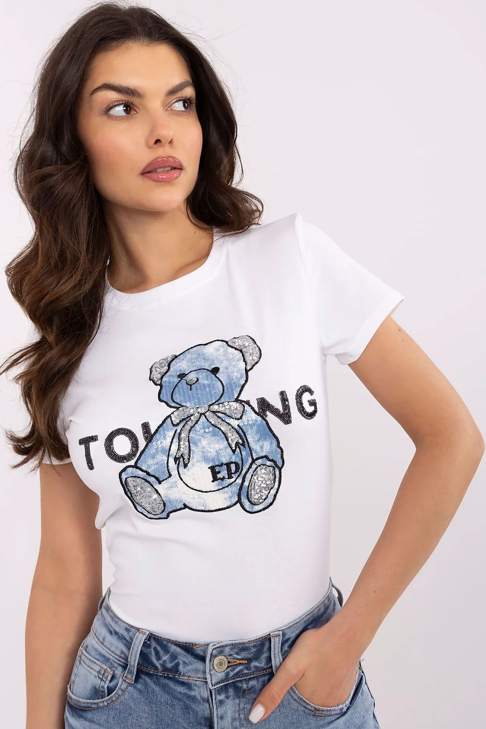 NM women's t-shirt with striking teddy bear embroidery, model presenting dynamic front view, ideal for casual luxury.