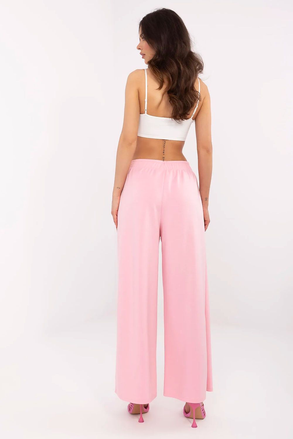 Elegant view of Italy Moda high waist wide leg tracksuit trousers in soft pink, showcasing the relaxed fit and luxurious fabric from the back.