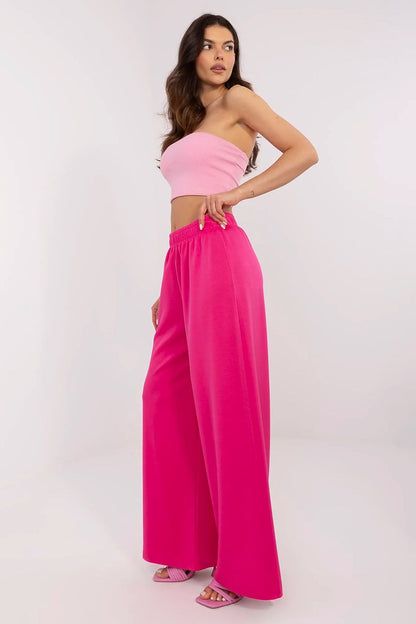 Sophisticated side profile of Italy Moda high waist wide leg tracksuit trousers in eye-catching pink, highlighting the modern silhouette and premium feel.