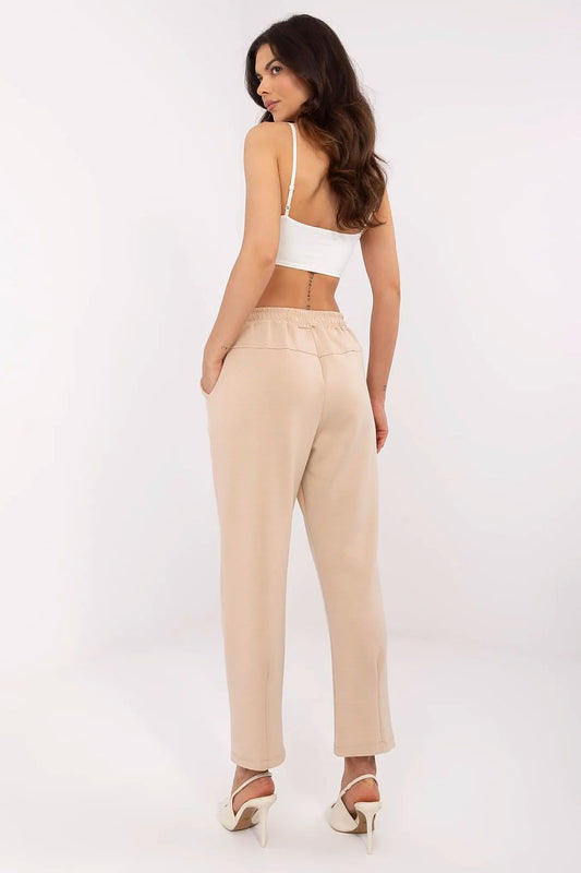 Elegant beige high waist tracksuit trousers for women by Italy Moda, showcasing a stylish back view with a fitted silhouette.
