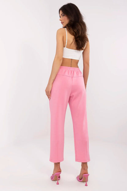 Italy Moda stylish high waist pink sweatpants for women, with a back view highlighting the comfortable fit, paired with a white crop top, suitable for lounge or everyday wear.