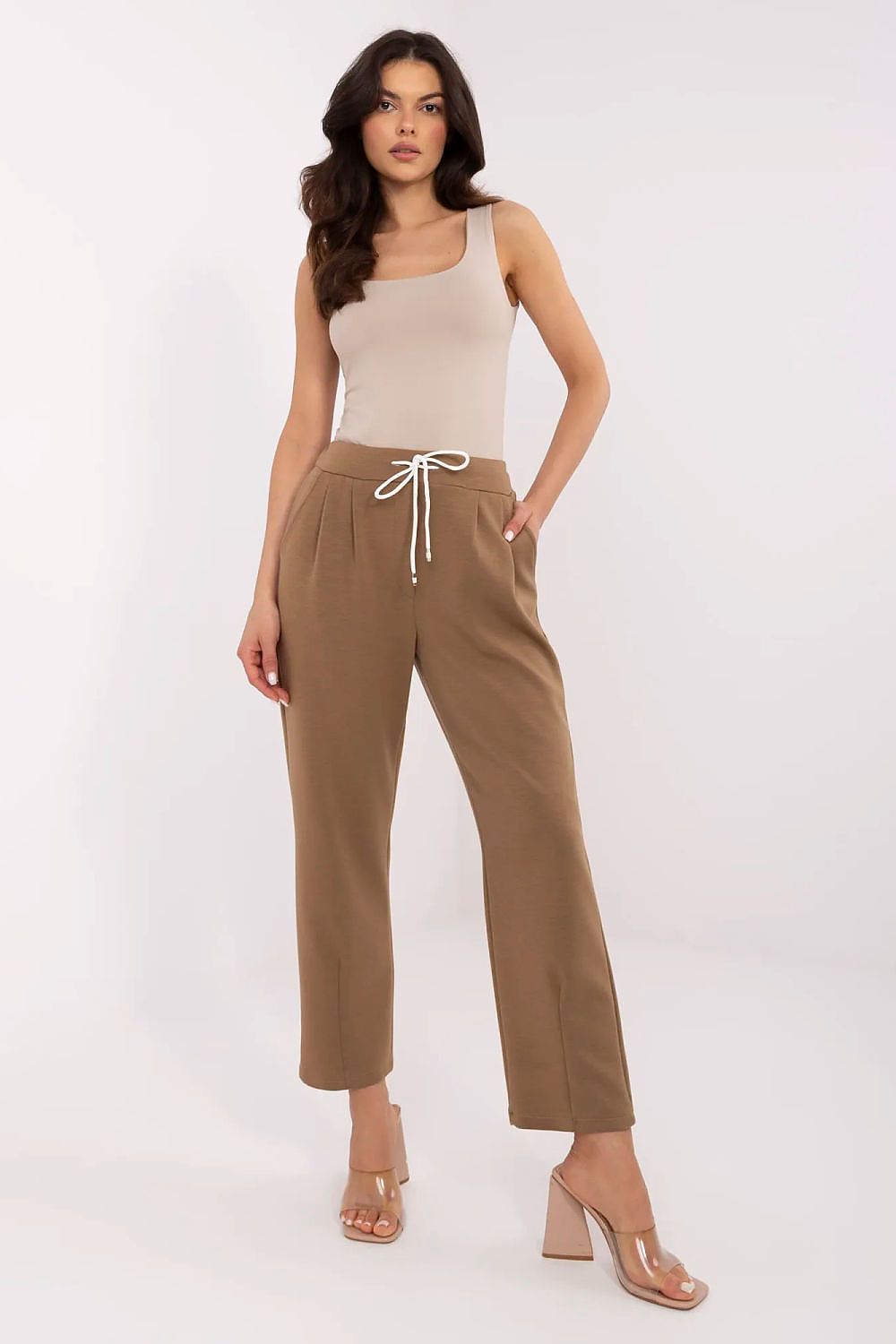 Italy Moda sophisticated high waist beige tracksuit trousers for women, designed with a flattering silhouette, worn with a neutral tank top, perfect for versatile styling.