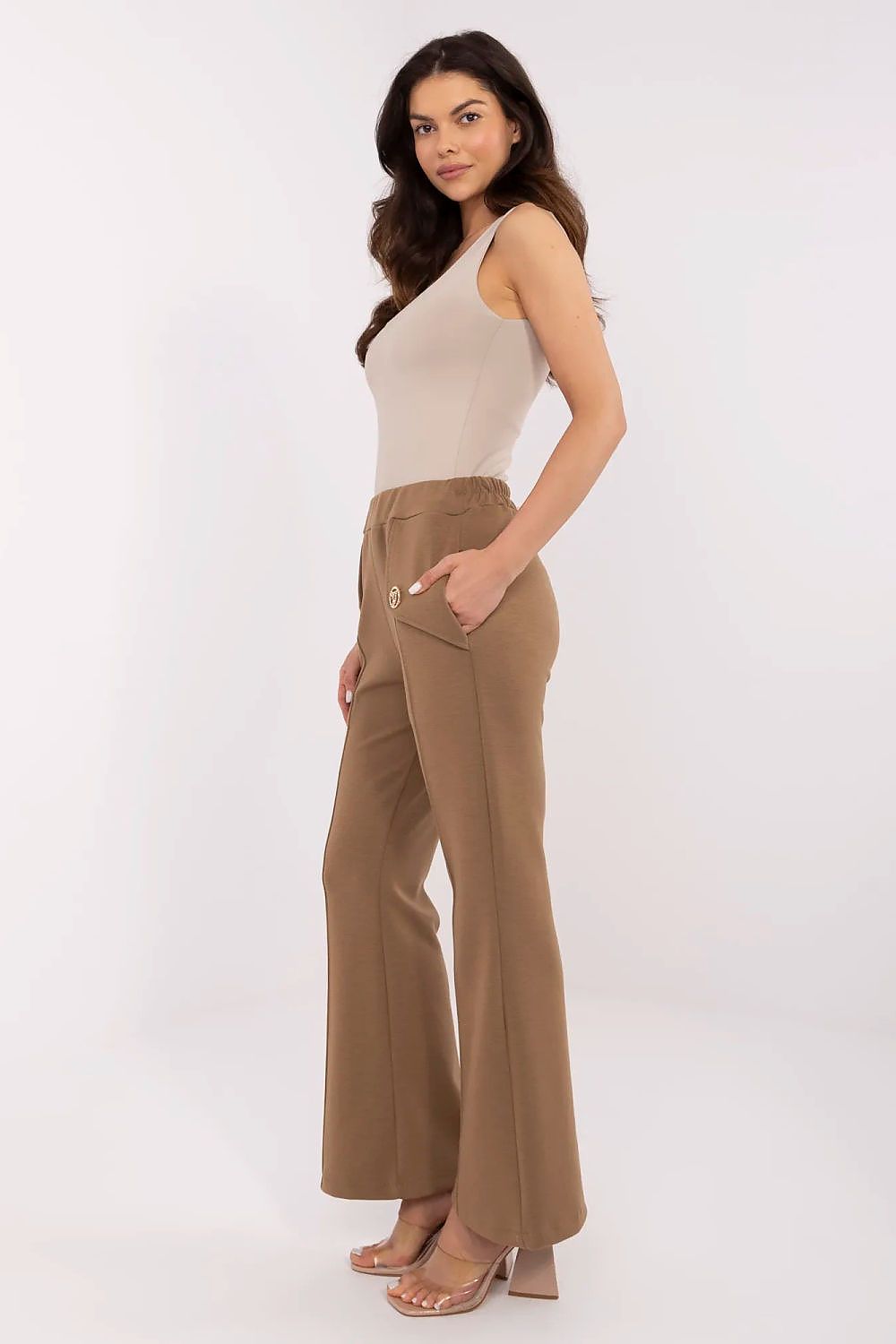 Side profile of a fashionable woman in Italy Moda high waist bell-shaped sweatpants, highlighting the comfort of the elastic waistband and chic design.