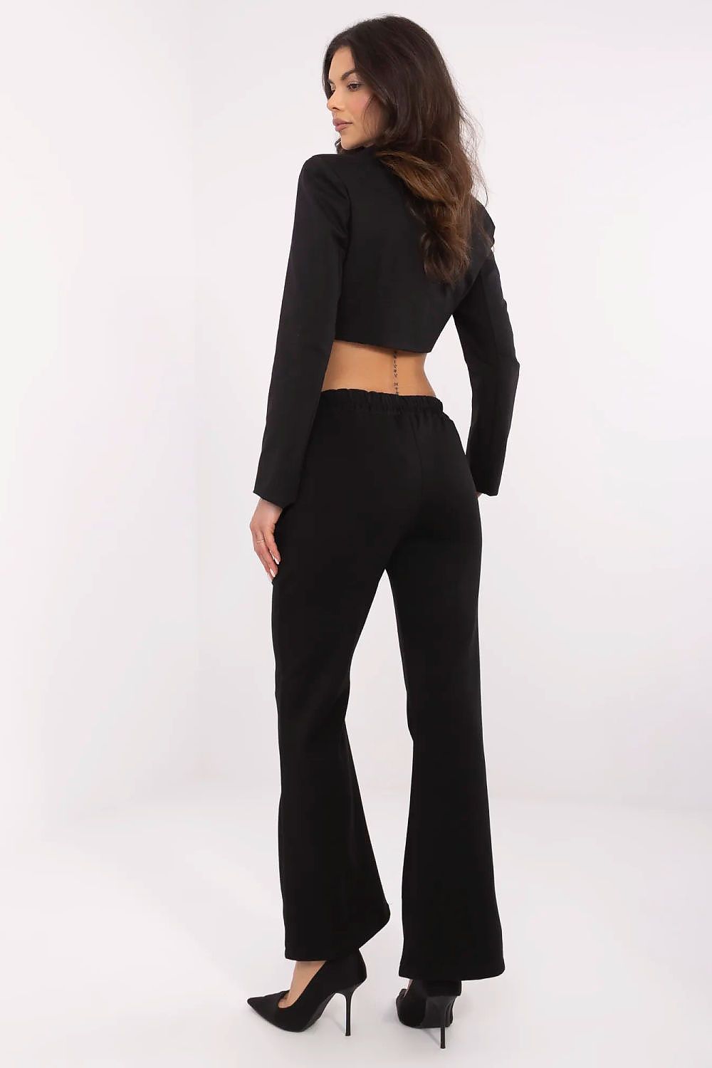 Classic black high waist bell-shaped sweatpants by Italy Moda, displayed from the back with a matching cropped jacket, blending elegance and comfort for versatile styling.