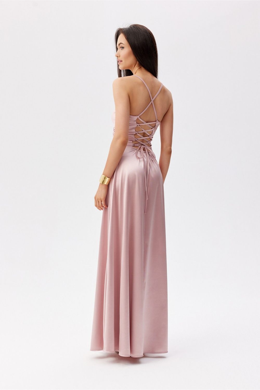 Back view of the elegant Roco Fashion maxi dress, highlighting the decorative lacing and thin straps in a chic pink design.
