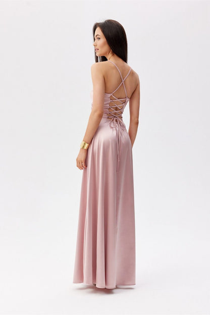 Back view of the elegant Roco Fashion maxi dress, highlighting the decorative lacing and thin straps in a chic pink design.