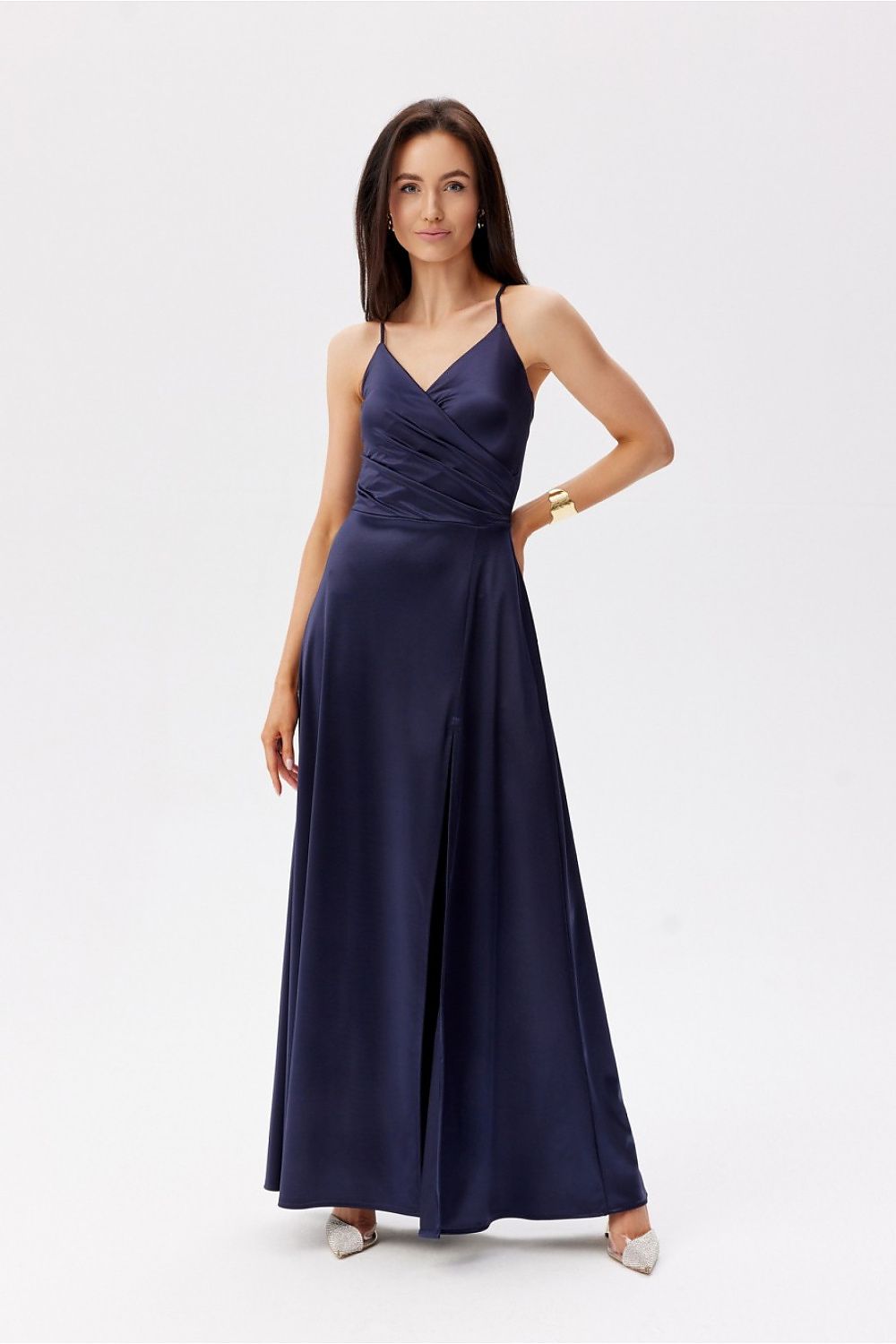 Chic navy blue Roco Fashion maxi dress showcased elegantly, with a wrap-around design and a leg slit, ideal for upscale events.