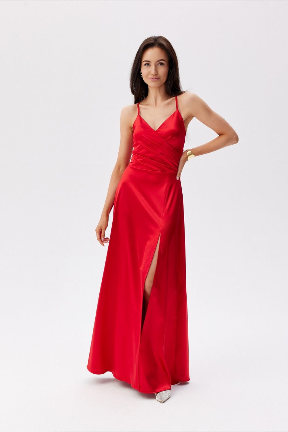 Sophisticated Roco Fashion Maxi Dress in red featuring thin straps and a chic thigh-high slit for refined elegance.