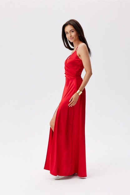 Graceful Roco Fashion Maxi Dress in red, showcasing a wrap-around top and a flattering silhouette that enhances feminine curves.