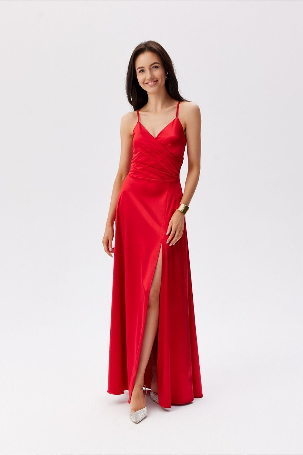 Stylish Roco Fashion Maxi Dress in red, artistically designed with thin straps and a daring slit, exuding glamour and sophistication.