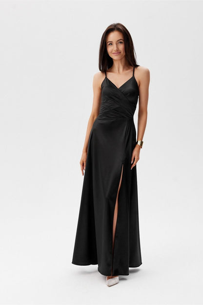 Elegant black maxi dress with a thigh-high slit and thin straps by Roco Fashion, perfect for formal occasions.