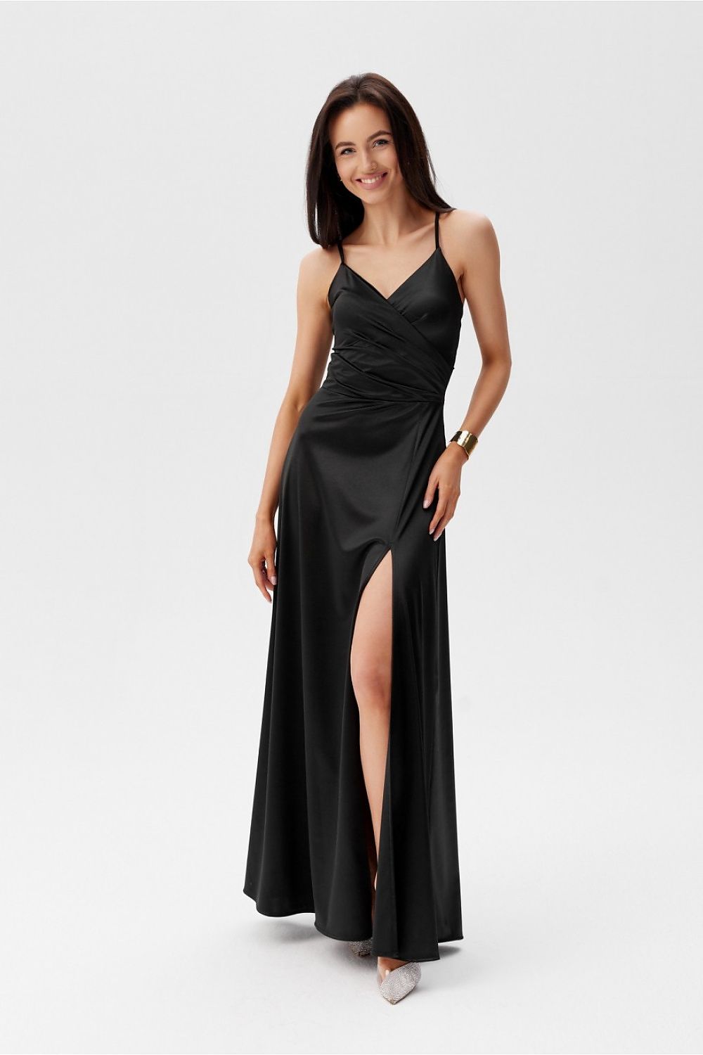 Black maxi dress by Roco Fashion featuring a stylish wrap-around design and thigh-high slit, ideal for evening events.