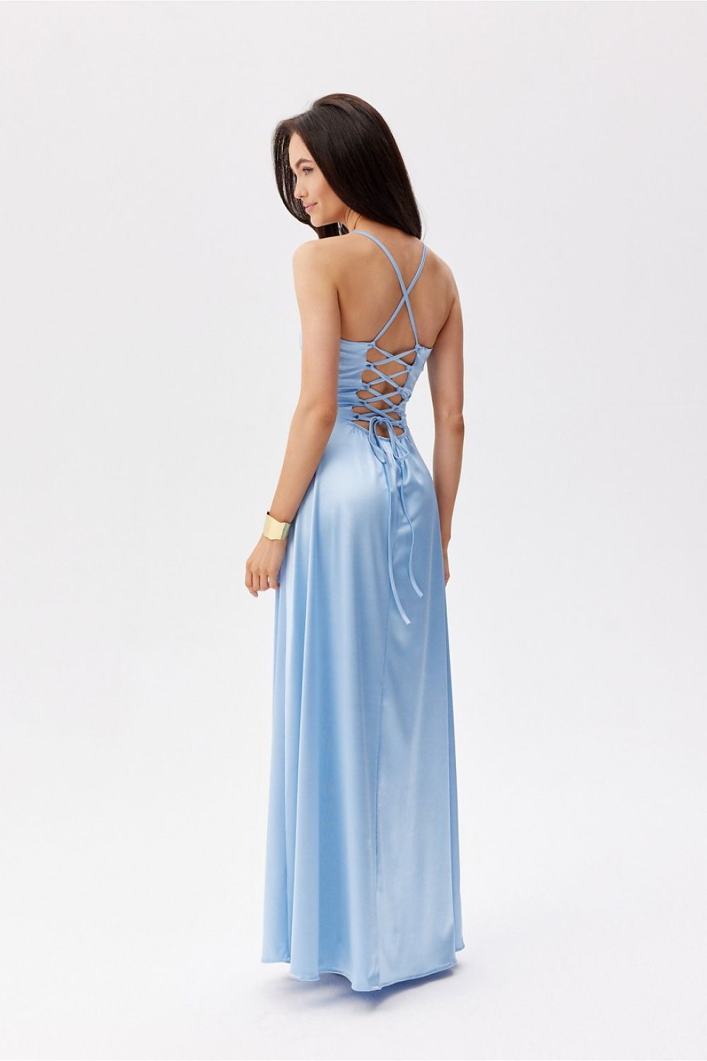 Back view of a luxurious blue maxi dress by Roco Fashion with decorative lacing and thin straps for a tailored fit.