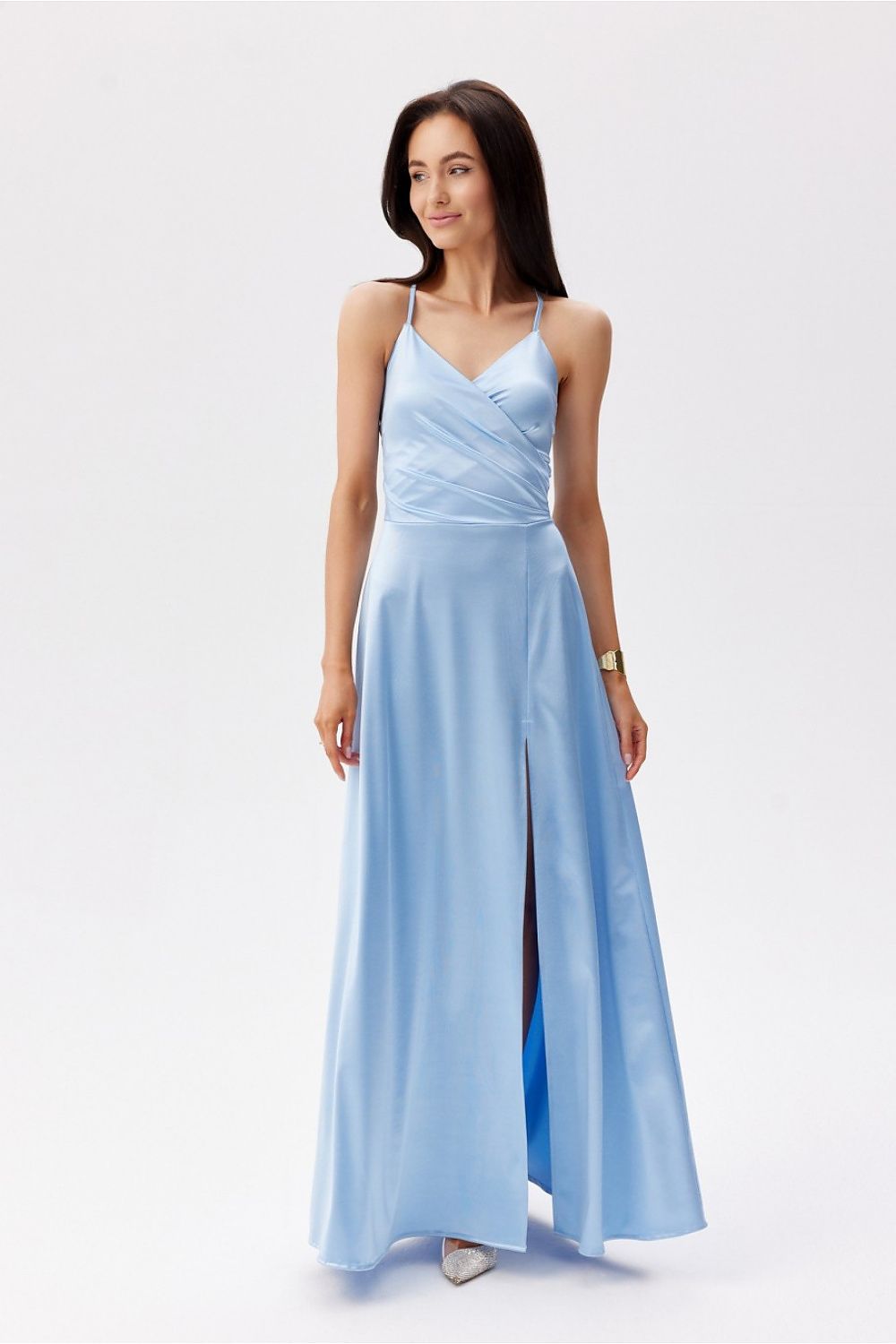 Front view of a stunning blue Roco Fashion maxi dress, showcasing a wrap-around design and flattering silhouette with a dramatic slit.