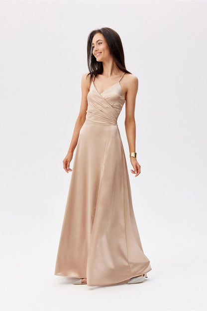 Chic beige maxi dress by Roco Fashion with a wrap-around bodice and thin straps, exuding elegance for evening events.