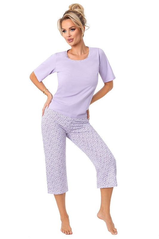 Luxurious women's cotton pyjama set by Donna, featuring a stylish short sleeve top and trendy 3/4 shorts in a delicate lilac print, perfect for elegant lounging and relaxation.