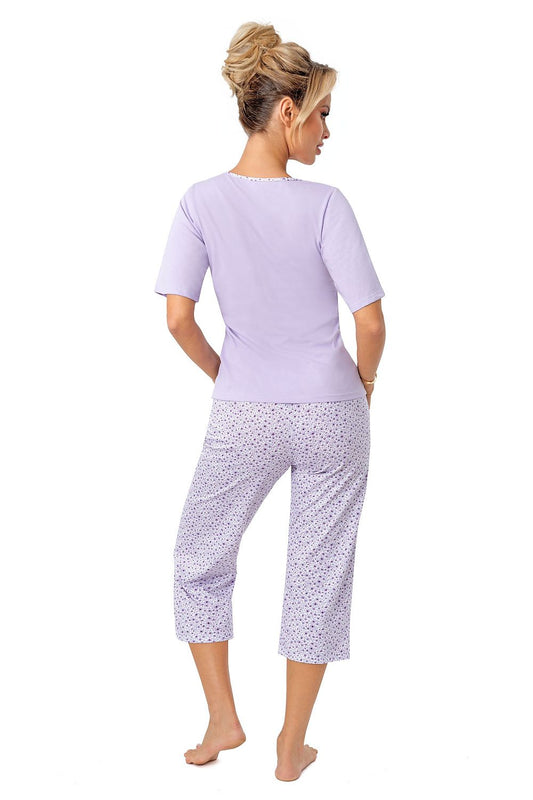 Back view of a chic women's cotton pyjama set by Donna, showcasing a fashionable short sleeve top and 3/4 shorts, designed in a serene lilac colour, ideal for a sophisticated sleepwear collection.