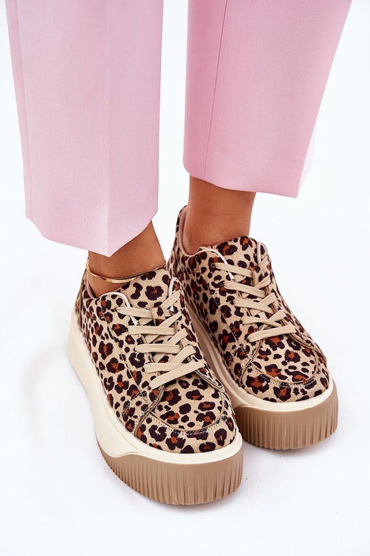 Luxury women's eco suede sport shoes from Step in Style, featuring a trendy leopard print design, a comfortable platform height of 5cm, and paired with fashionable pink trousers.