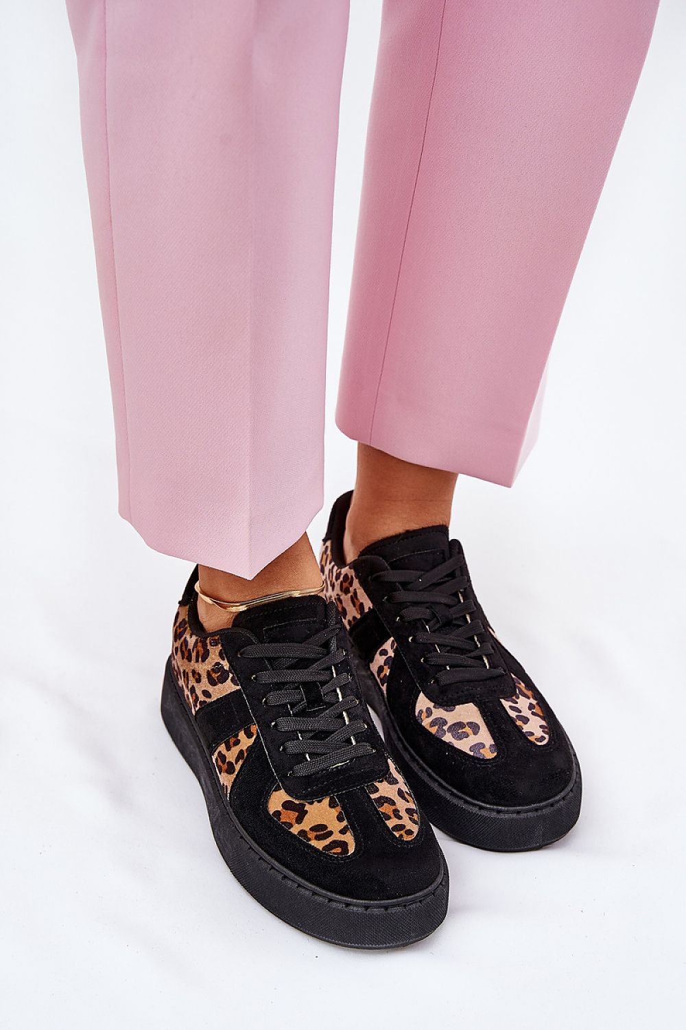 Trendy luxury leopard print women's sneakers worn with pink trousers, crafted by Step in Style.