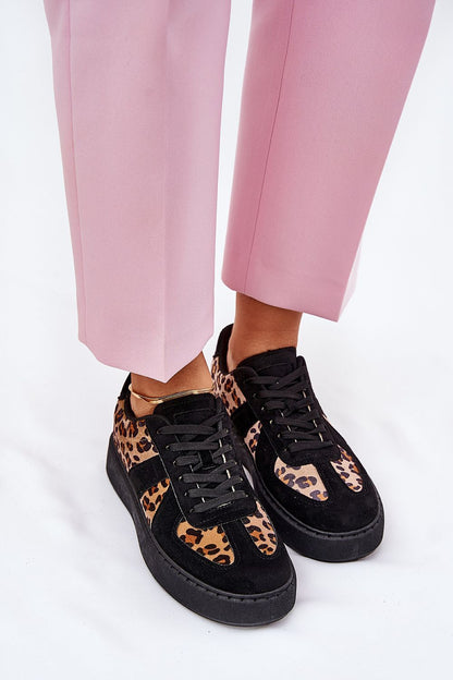 Trendy luxury leopard print women's sneakers worn with pink trousers, crafted by Step in Style.