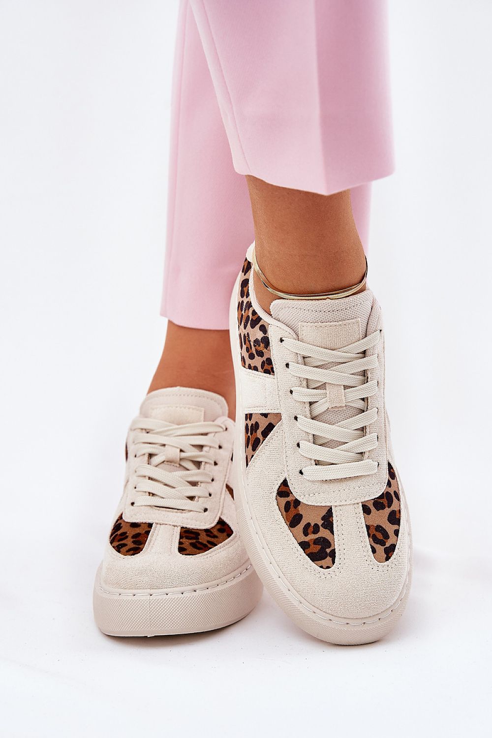 Luxury women's stylish sneakers by Step in style featuring eco leather and fabric with a trendy leopard print design, worn with pink trousers.