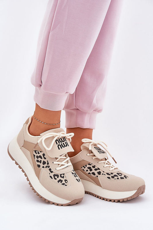 Stylish women's eco suede sports shoes with leopard print accents, designed for comfort and modern aesthetics, showcased by Step in Style. Perfect for casual wear and sporting a unique rolled-up detail.