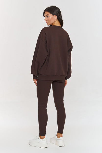 Model wearing Makadamia's luxury women's cotton-spandex sweatsuit set, perfect for casual outings and relaxation.