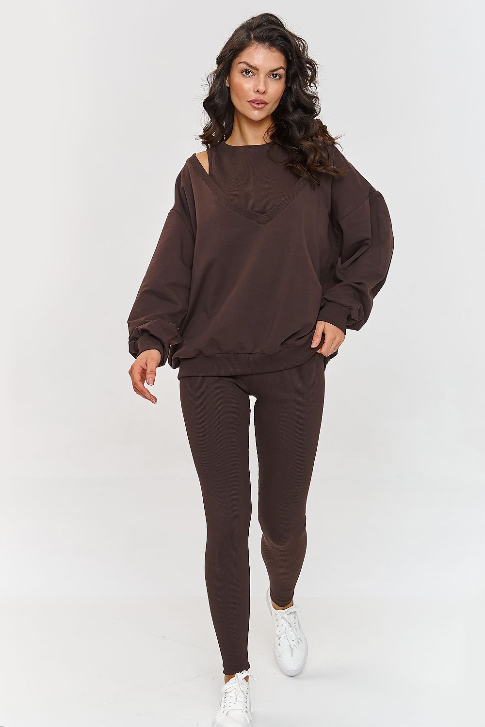 Luxury Makadamia women's oversized tracksuit set featuring a stylish sweatshirt and fitted ribbed leggings, perfect for comfort and elegance in everyday wear.