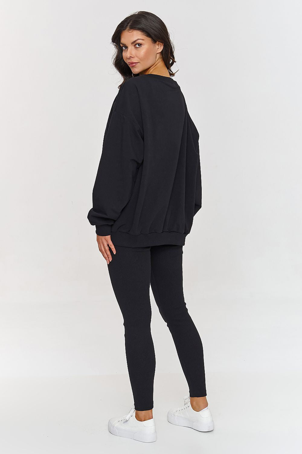 Makadamia luxury tracksuit set, combining a relaxed sweatshirt and trendy leggings for versatile styling.