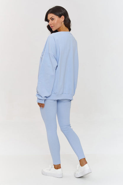 Stylish women's tracksuit set by Makadamia featuring an oversized sweatshirt paired with ribbed leggings, perfect for casual outings.