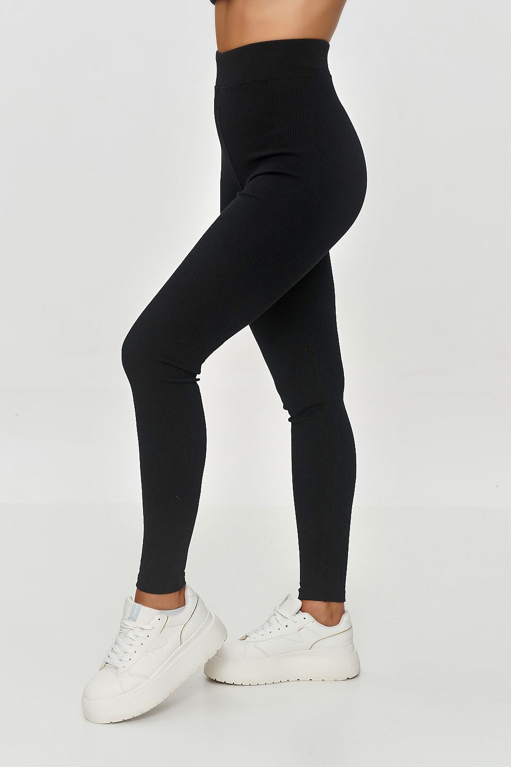 Elegant high-waisted long leggings by Makadamia, showcasing a fitted soft ribbed design, perfect for accentuating the silhouette