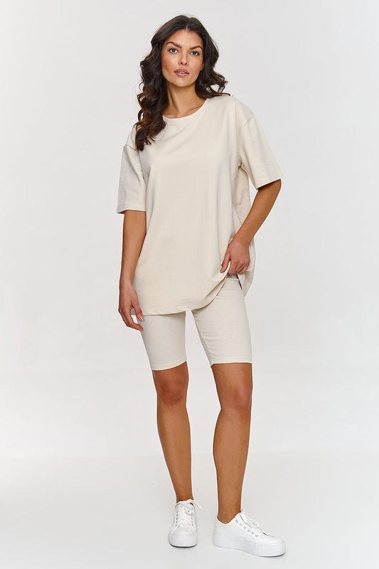 Luxury oversized cotton t-shirt from Makadamia, featuring a minimalist design with ribbed collar, perfect summer essential.