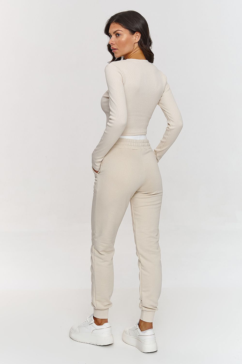 Luxurious Makadamia cotton set featuring an elegant long sleeve shirt and comfortable sweatpants, designed for sizes 36-38, showcasing subtle elegance and sporty comfort.