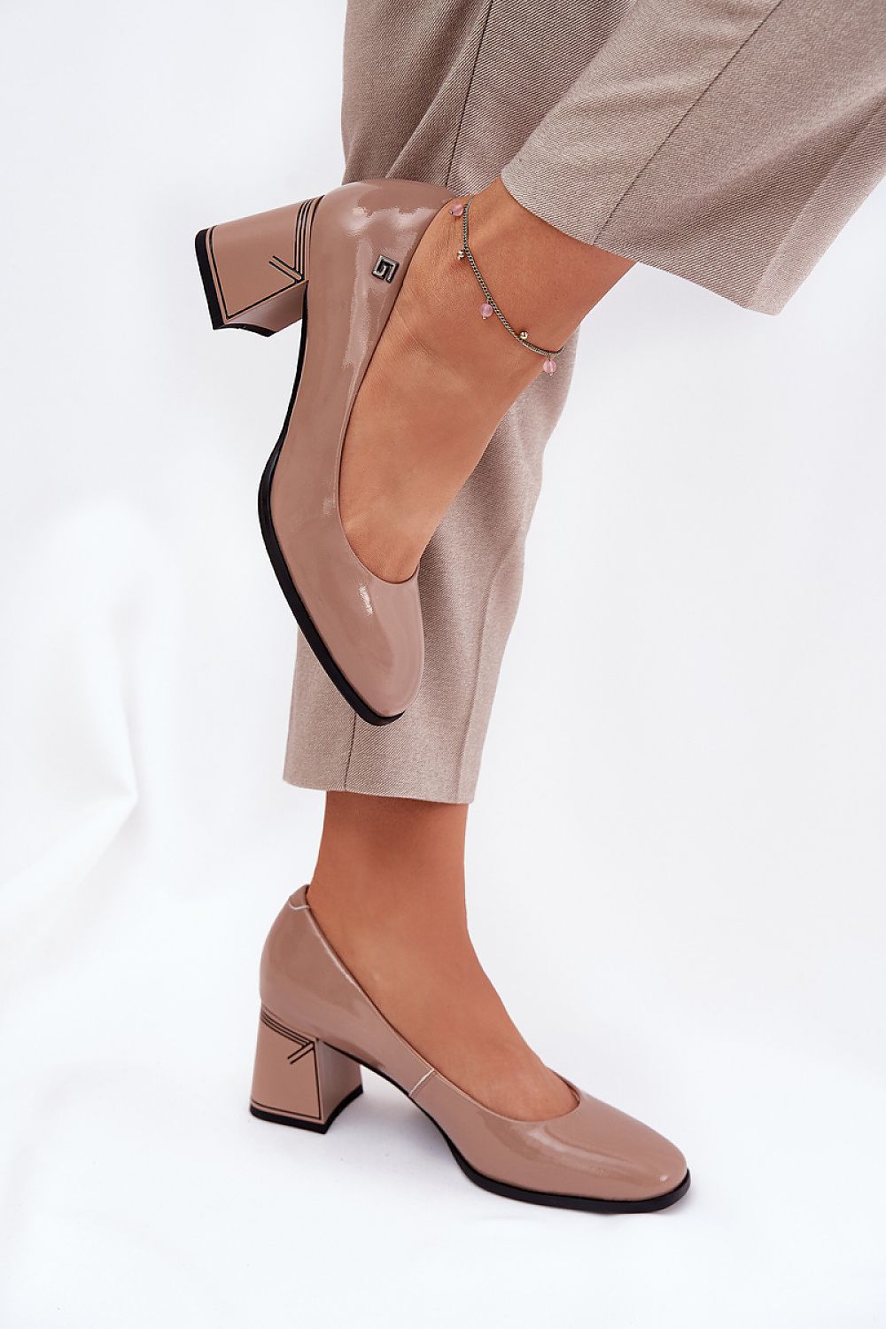 Elegant natural patent leather block heel pumps for women designed by Step in Style, featuring a chic and sophisticated look with a column-shaped heel, perfect for dressing up any outfit.