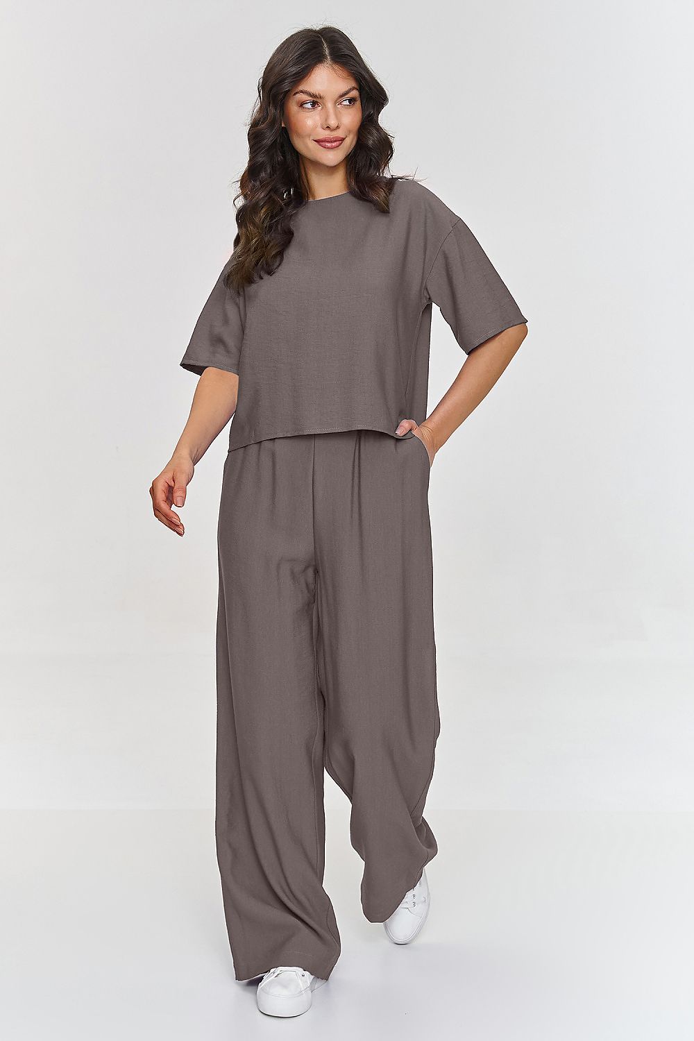 Elegant Makadamia 2-Piece Blouse and Wide Leg Pants Set in light fabric, showcasing a sophisticated short sleeve blouse and stylish wide leg pants, ideal for luxurious spring and summer outings.