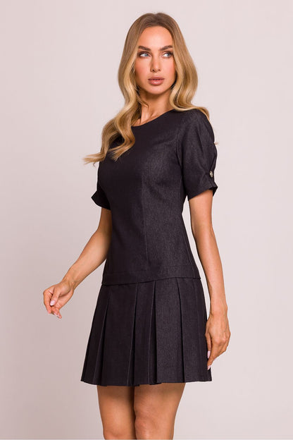 Elegant mini dress by Moe with unique short sleeves, decorative buttons, and a hidden zipper, embodying chic and sophisticated fashion.