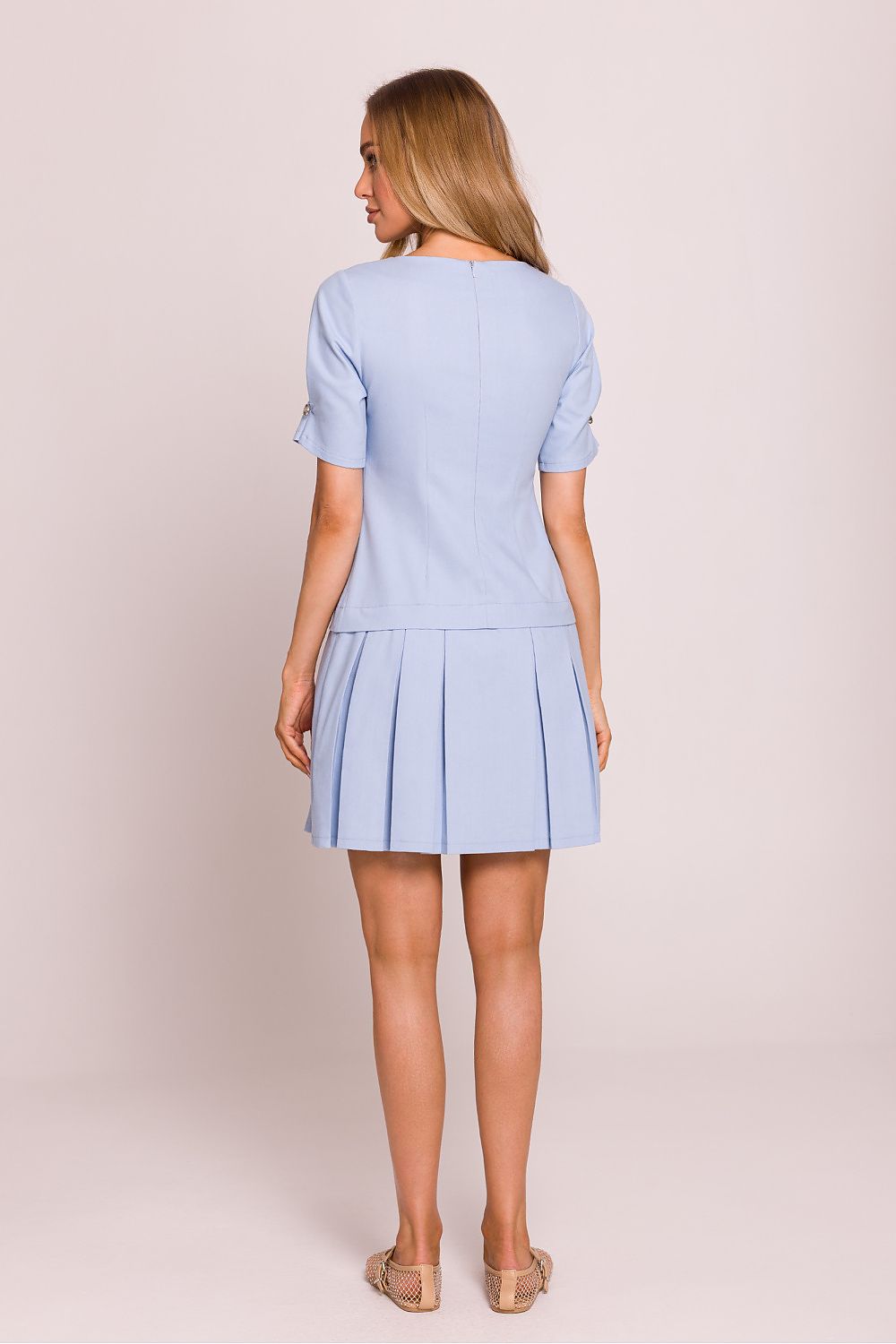Back view of the Moe mini dress with a hidden zipper, illustrating the lightweight design and meticulous craftsmanship ideal for elegant occasions.